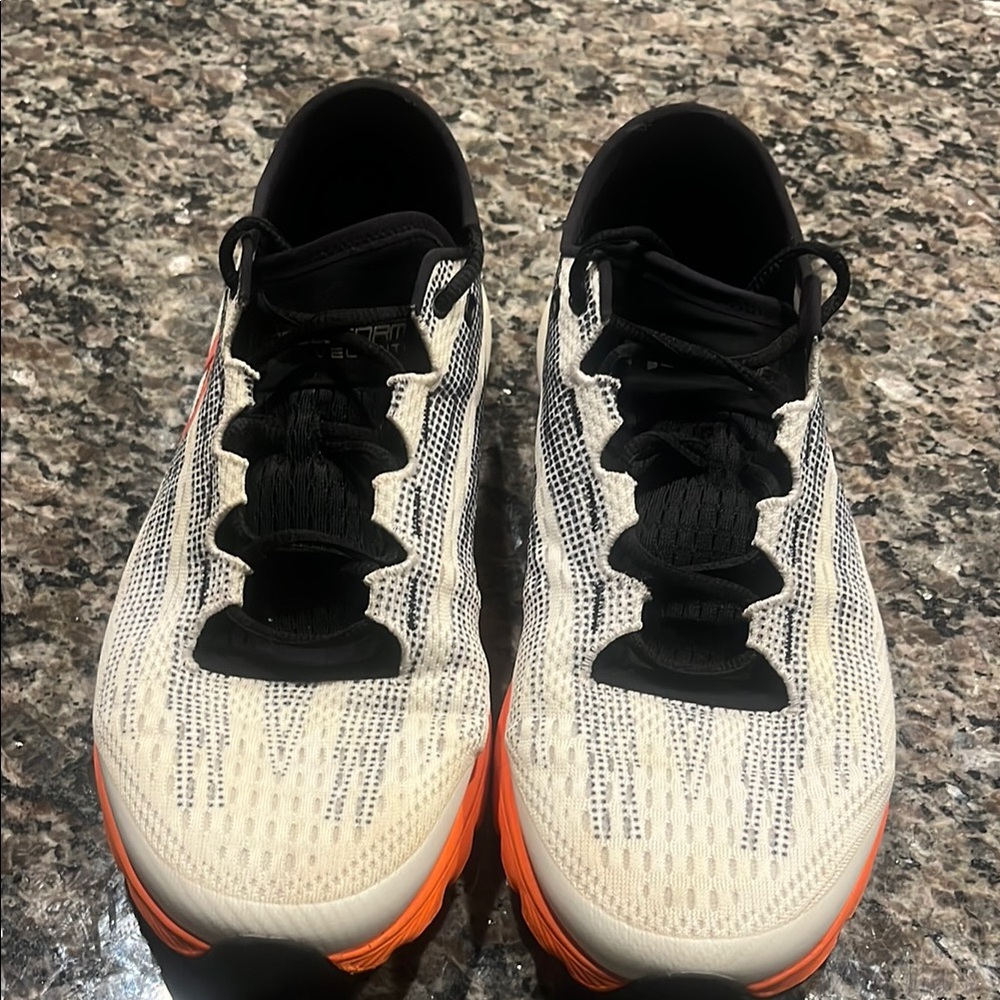 Under Armour Cream and Black Athletic Shoes with Streamlined Silhouette